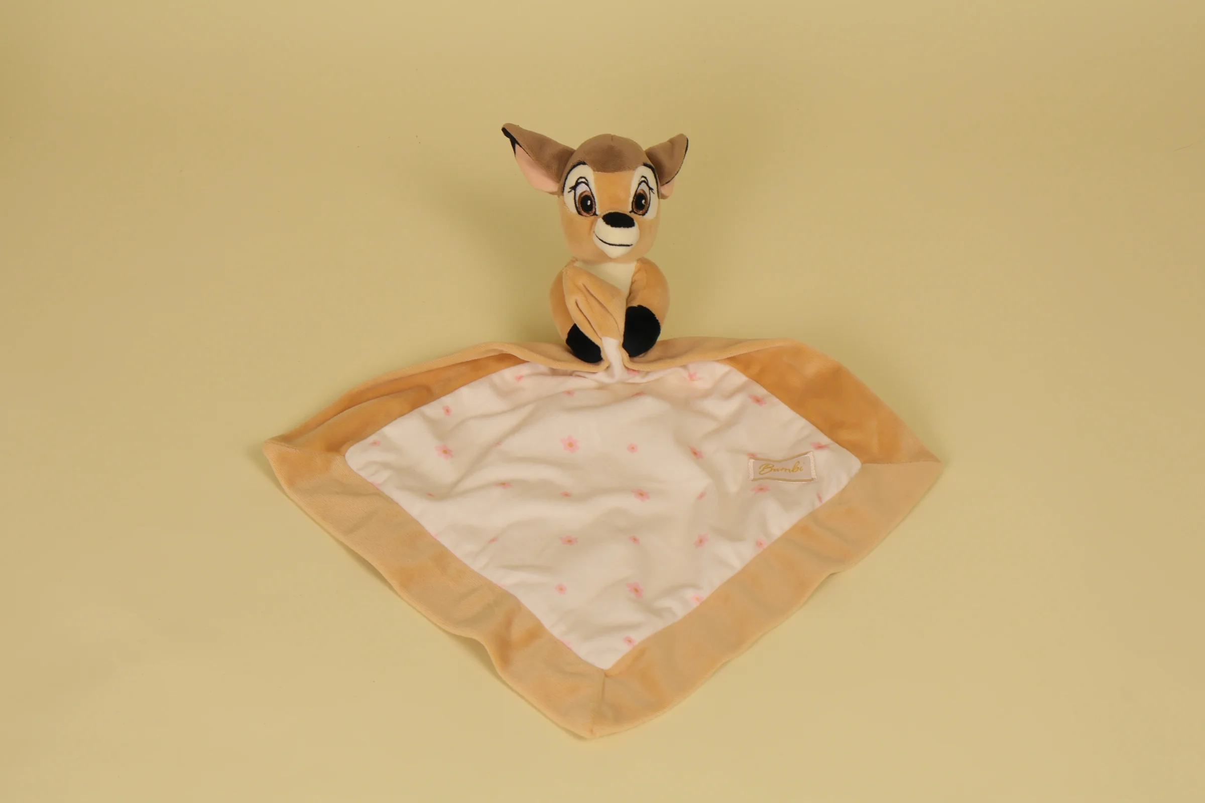 Doudou Bambi plat beige marron et creme avec imprime fleurs edition 2017 marque Disney Baby