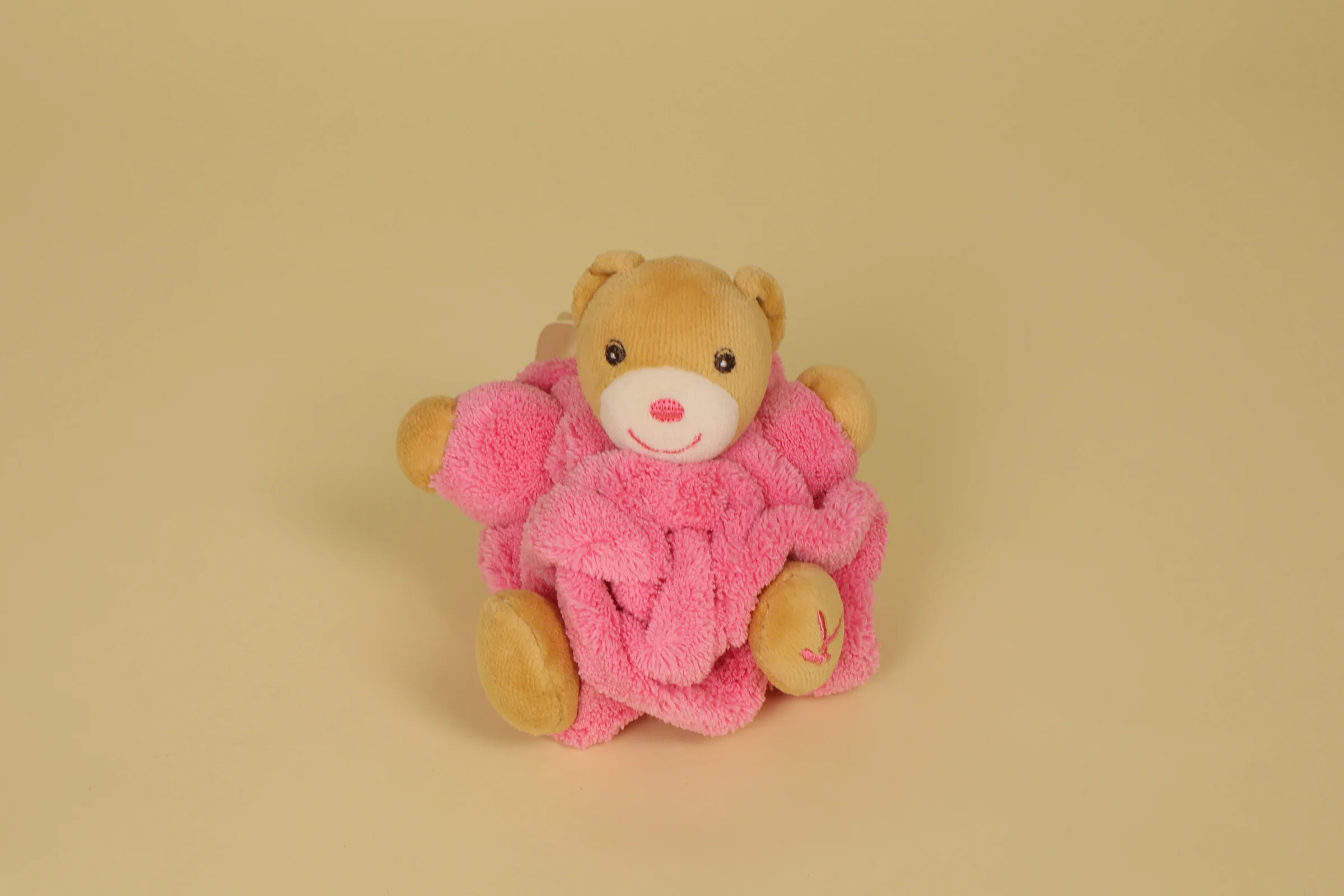 Mini doudou ours boule rose et marron 12 cm Plume marque Kaloo